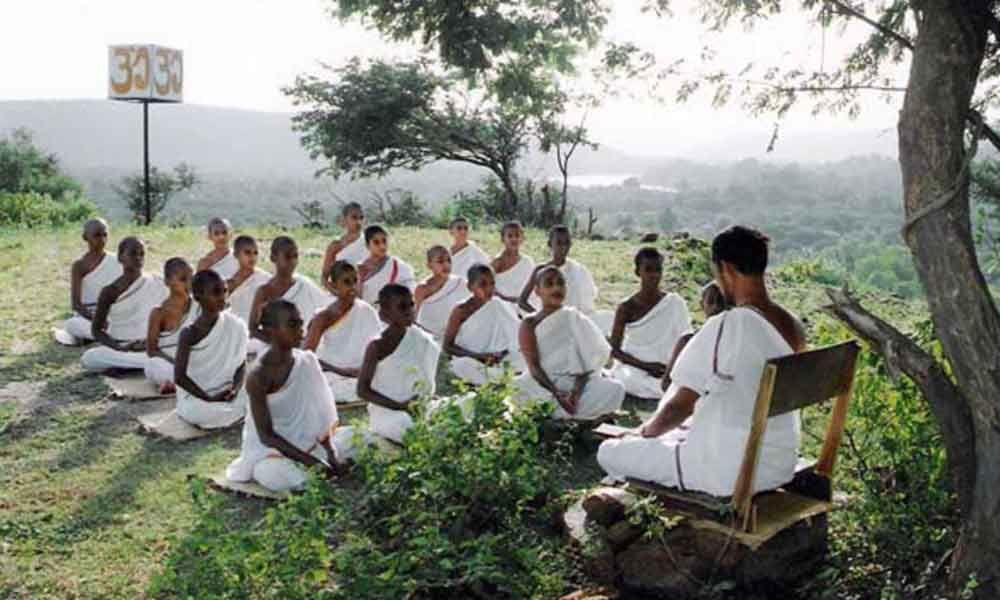 Brahmacārīs sitting before the guru.